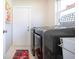 Modern laundry room with front-load washer and dryer, plus natural light at 1601 E Del Webb Blvd, Sun City Center, FL 33573