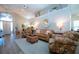 Cozy living room with neutral tones, comfortable furnishings, and plenty of natural light at 1601 E Del Webb Blvd, Sun City Center, FL 33573