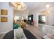 Open-concept living space with hardwood floors, ample natural light, and access to the kitchen at 1601 E Del Webb Blvd, Sun City Center, FL 33573