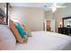 Comfortable main bedroom features a four-poster bed and neutral color scheme at 1601 E Del Webb Blvd, Sun City Center, FL 33573