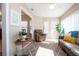 Enclosed sunroom with tile floors, lots of windows, and a ceiling fan at 1601 E Del Webb Blvd, Sun City Center, FL 33573