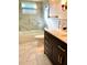 Modern bathroom with elegant marble-like tile, a luxurious vanity, and a glass shower at 1616 S Lake Ave # 4, Clearwater, FL 33756