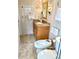 Neutral toned bathroom with a decorative tile accent, bidet, and single sink vanity at 1616 S Lake Ave # 4, Clearwater, FL 33756