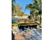 Inviting outdoor bench surrounded by potted plants, offering a serene spot in the community at 1616 S Lake Ave # 4, Clearwater, FL 33756