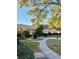 Beautifully landscaped community area with lush greenery, trees, and a well-maintained walking path at 1616 S Lake Ave # 4, Clearwater, FL 33756