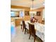 Formal dining area with decorative lighting fixture and seating for six at 1616 S Lake Ave # 4, Clearwater, FL 33756