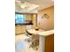 Bright kitchen features tile floors, white appliances, and updated countertops at 1616 S Lake Ave # 4, Clearwater, FL 33756