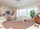 Bright living room with lots of natural light, comfortable seating, and a ceiling fan at 1616 S Lake Ave # 4, Clearwater, FL 33756
