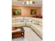 Comfortable living room with a large sectional sofa and bright, warm paint at 1616 S Lake Ave # 4, Clearwater, FL 33756