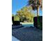 Landscaped entrance to a tennis court, surrounded by lush greenery and manicured hedges at 1616 S Lake Ave # 4, Clearwater, FL 33756