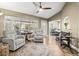 Bright and airy living area featuring wood floors and comfortable seating at 1709 Tremont Ct, Sun City Center, FL 33573