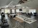 Community clubhouse featuring tables, chairs, and ample space for social gatherings and community events at 1725 Pine Ridge E Way # C, Palm Harbor, FL 34684
