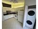 Bright and modern eat-in kitchen with tiled floors at 1725 Pine Ridge E Way # C, Palm Harbor, FL 34684