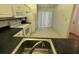 Bright kitchen featuring modern appliances and eat in space at 1725 Pine Ridge E Way # C, Palm Harbor, FL 34684