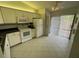The well lit eat-in kitchen is equipped with modern appliances at 1725 Pine Ridge E Way # C, Palm Harbor, FL 34684