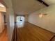Spacious living room boasts hardwood floors, a ceiling fan, and large windows for natural light at 1725 Pine Ridge E Way # C, Palm Harbor, FL 34684