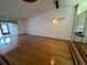 Spacious living room with hardwood floors, ceiling fan and natural light at 1725 Pine Ridge E Way # C, Palm Harbor, FL 34684