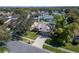 Single Gathering home surrounded by mature trees in a well-maintained neighborhood on a sunny day at 1728 Elk Spring Dr, Brandon, FL 33511