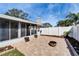 Backyard featuring a screen porch, privacy fence, and a beautiful brick paver patio at 1728 Elk Spring Dr, Brandon, FL 33511