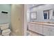 The bathroom features a large countertop with dual sinks and cabinetry for storage at 1728 Elk Spring Dr, Brandon, FL 33511