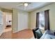 This bedroom has wood-look floors, a closet with sliding doors, and an adjoining bathroom at 1728 Elk Spring Dr, Brandon, FL 33511