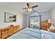 The bedroom features wood floors, ceiling fan, paint and a large window at 1728 Elk Spring Dr, Brandon, FL 33511