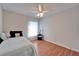 Bright bedroom featuring hardwood floors and a ceiling fan for comfortable living at 1728 Elk Spring Dr, Brandon, FL 33511