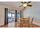 Bright dining area features sliding glass doors to screened porch and classic wood table and chairs at 1728 Elk Spring Dr, Brandon, FL 33511