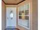 Home exterior showcases a white front door with oval window and a window that provides light into the entry way at 1728 Elk Spring Dr, Brandon, FL 33511