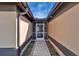 Exterior entrance to a home featuring a decorative front door and small landscaped features along walkway at 1728 Elk Spring Dr, Brandon, FL 33511