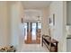 Inviting entryway featuring neutral tile flooring and views of the open-concept living and dining areas at 1728 Elk Spring Dr, Brandon, FL 33511