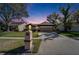 Charming home featuring a manicured lawn, mature trees, and a two-car garage, creating a welcoming curb appeal at 1728 Elk Spring Dr, Brandon, FL 33511