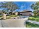 Inviting single-Gathering home with well-manicured lawn, mature trees, and a spacious two-car garage at 1728 Elk Spring Dr, Brandon, FL 33511