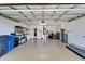 Spacious garage with epoxy flooring, storage shelving, and ample room for vehicles at 1728 Elk Spring Dr, Brandon, FL 33511