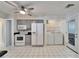 The kitchen features white appliances, gray cabinets and in-unit washer and dryer hookups at 1728 Elk Spring Dr, Brandon, FL 33511