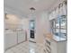 This is a view of the laundry area that features a door to the garage and additional cabinetry at 1728 Elk Spring Dr, Brandon, FL 33511