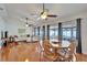 Spacious open-concept living and dining area, with hardwood floors and a view of the screened outdoor patio at 1728 Elk Spring Dr, Brandon, FL 33511