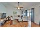 Cozy living room featuring hardwood floors, neutral decor, and natural light from sliding glass doors at 1728 Elk Spring Dr, Brandon, FL 33511