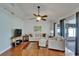 Bright living room featuring wood flooring, neutral walls, and sliding doors offering lots of natural light at 1728 Elk Spring Dr, Brandon, FL 33511