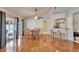 Open living space showing dining area, kitchen bar and access to the screened patio at 1728 Elk Spring Dr, Brandon, FL 33511