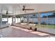 Inviting sunroom with tile flooring, large windows, and fans for year-round enjoyment at 1728 Elk Spring Dr, Brandon, FL 33511