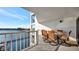 Balcony furnished with a glass table and comfortable wicker chairs perfect for relaxation at 2 Adalia Ave # 803, Tampa, FL 33606