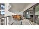 Outdoor dining set on the private balcony with sliding glass door and water view at 2 Adalia Ave # 803, Tampa, FL 33606
