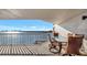 Waterfront balcony featuring a dining table and chairs overlooking the ocean and cityscape at 2 Adalia Ave # 803, Tampa, FL 33606