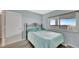 This bedroom features light blue walls, a door, and a black wrought iron bed frame at 2 Adalia Ave # 803, Tampa, FL 33606