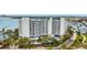 Exterior view of waterfront condo building featuring multiple balconies and parking at 2 Adalia Ave # 803, Tampa, FL 33606