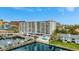 Exterior view of a waterfront condo building with a marina and easy access to waterways at 2 Adalia Ave # 803, Tampa, FL 33606