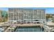 Exterior view of a waterfront condo building with a marina and easy access to waterways at 2 Adalia Ave # 803, Tampa, FL 33606