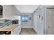 Kitchen with white cabinets, stainless appliances, backsplash, and a view of the city at 2 Adalia Ave # 803, Tampa, FL 33606