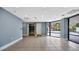 Bright condo lobby featuring neutral tile flooring, stainless steel elevator, and large impact glass window at 2 Adalia Ave # 803, Tampa, FL 33606